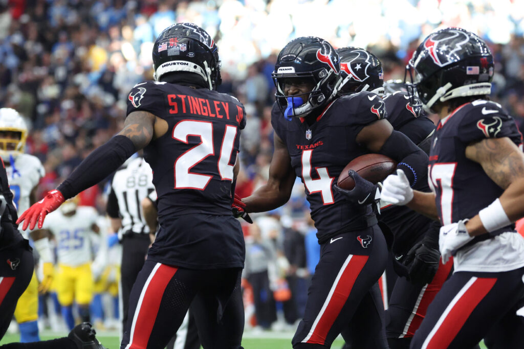 Houston Texans corner back Kamari Lassiter (4) celebrates an intercaption during the second quarter against the Los Angeles Chargers in an AFC wild card game at NRG Stadium.