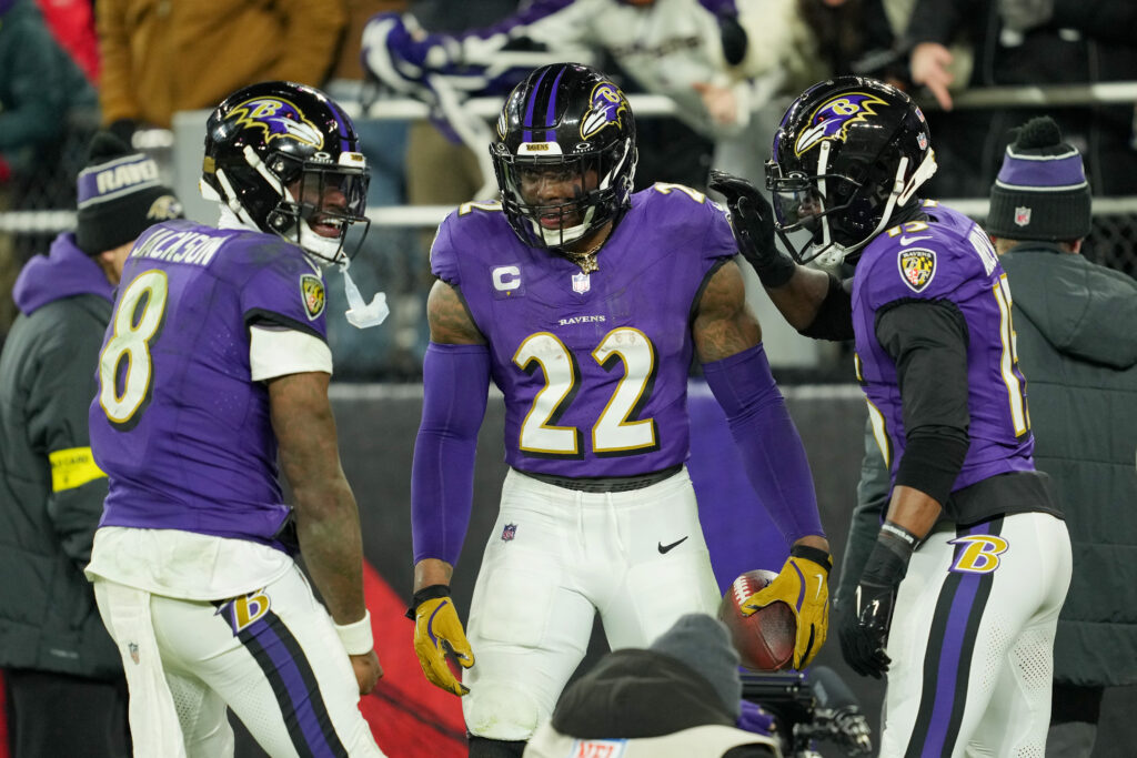 Baltimore Ravens running back Derrick Henry (22) celebrates with wide receiver Nelson Agholor (15) and quarterback Lamar Jackson (8) after scoring a touchdown against the Pittsburgh Steelers in the third quarter in an AFC wild card game.