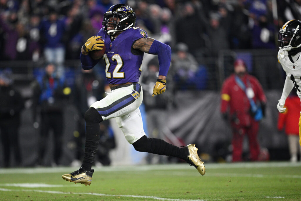 Baltimore Ravens running back Derrick Henry (22) runs to score a touchdown against the Pittsburgh Steelers in the third quarter in an AFC wild card game at M&T Bank Stadium.