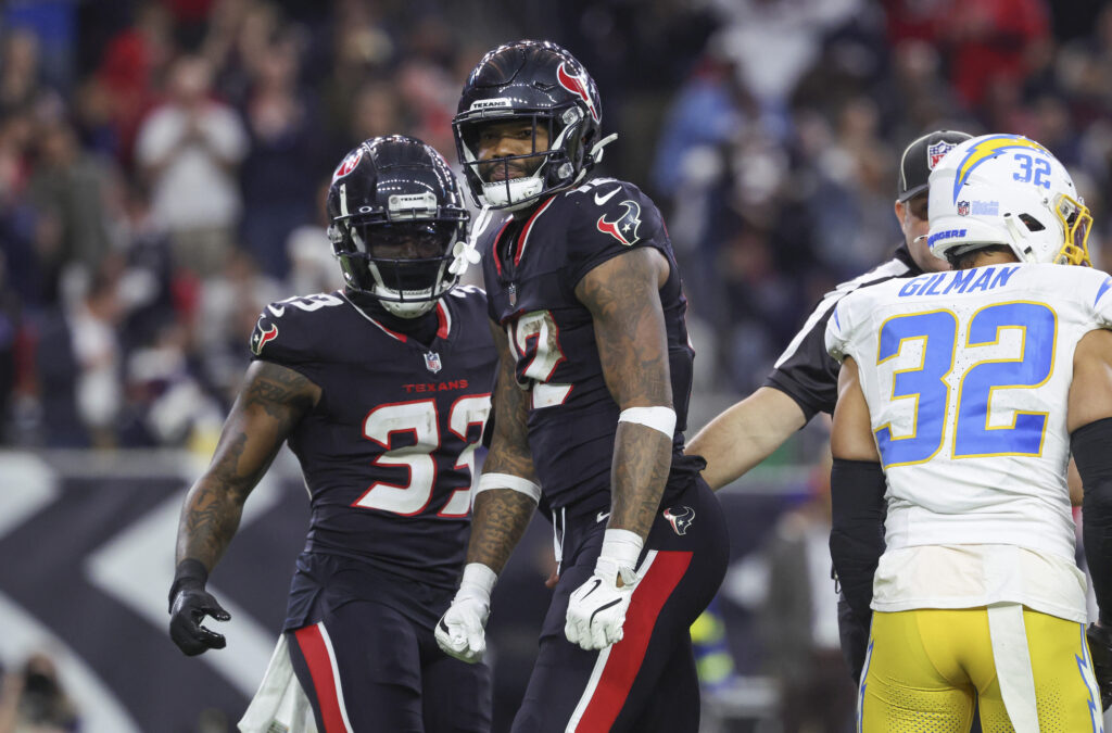 Houston Texans wide receiver Nico Collins (12) reacts after a reception during the game against the Los Angeles Chargers in an AFC wild card game at NRG Stadium. 