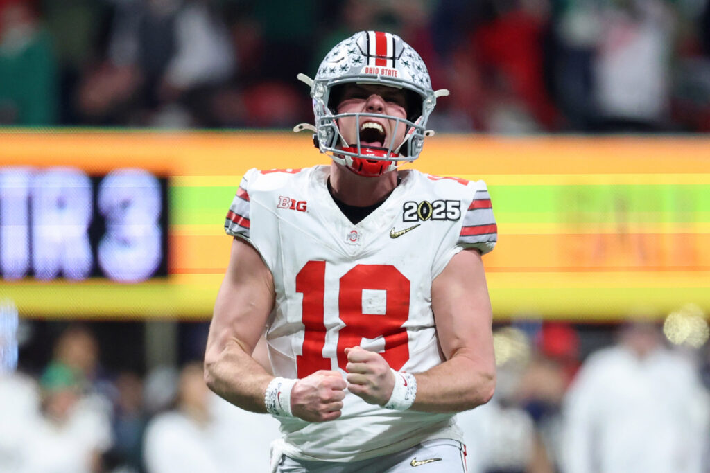 Ohio State Buckeyes quarterback Will Howard (18) reacts after a play against the Notre Dame Fighting Irish during the second half the CFP National Championship college football game at Mercedes-Benz Stadium.