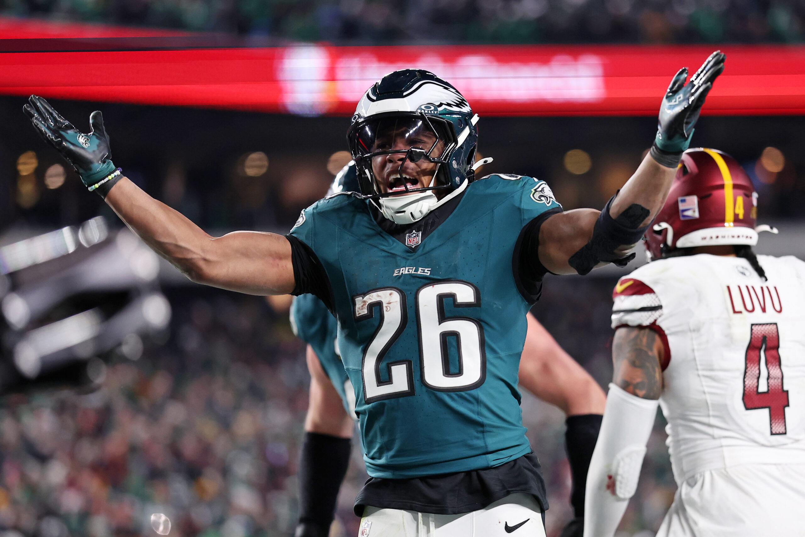 Philadelphia Eagles running back Saquon Barkley (26) celebrates after a touchdown against the Washington Commanders during the second half in the NFC Championship.