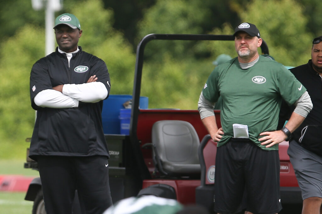 New York Jets head coach Todd Bowles (left) and offensive coordinator John Morton (right) watch organized team activities at the Atlantic Health Jets Training Center.