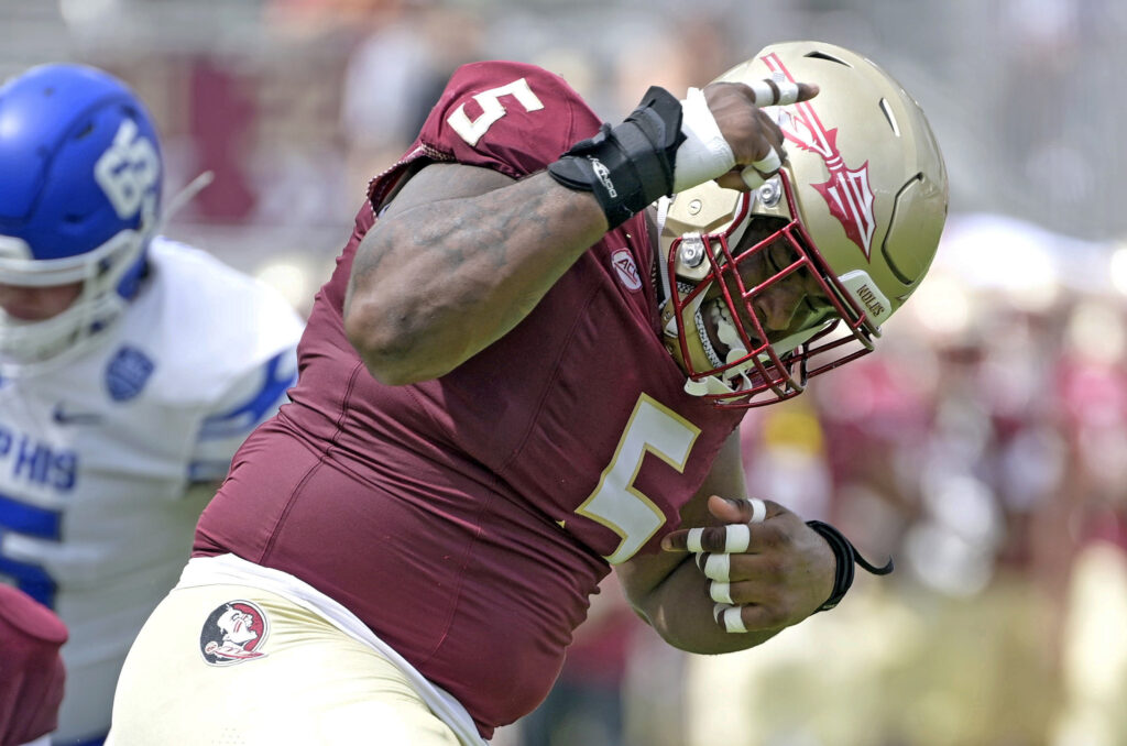 Florida State Seminoles defensive lineman Joshua Farmer (5) celebrates after a defensive stop against the Memphis Tigers during the first half.