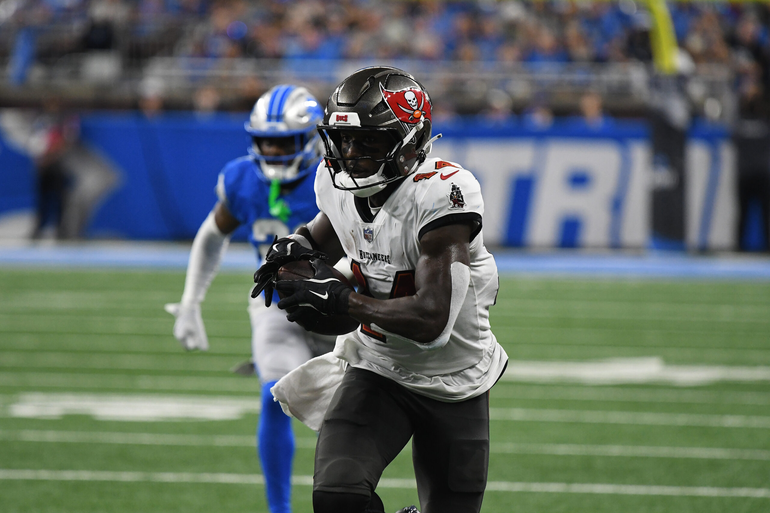 Tampa Bay Buccaneers wide receiver Chris Godwin (14) scores a touchdown against the Detroit Lions at Ford Field.