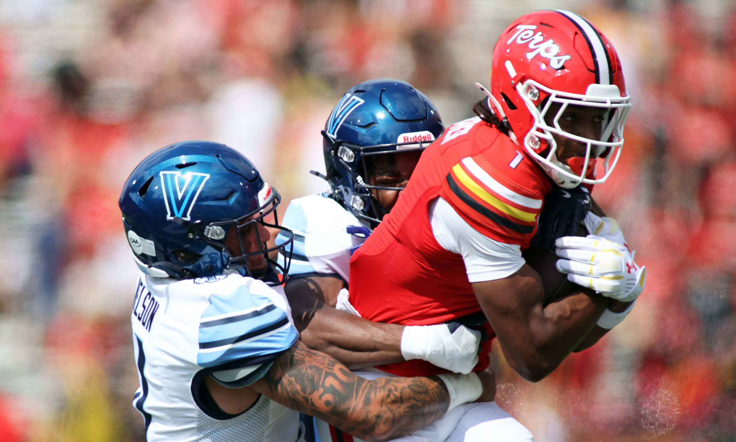 Maryland Terrapins wide receiver Kaden Prather (1) is tackled by multiple Villanova Wildcats defenders during the first quarter at SECU Stadium.