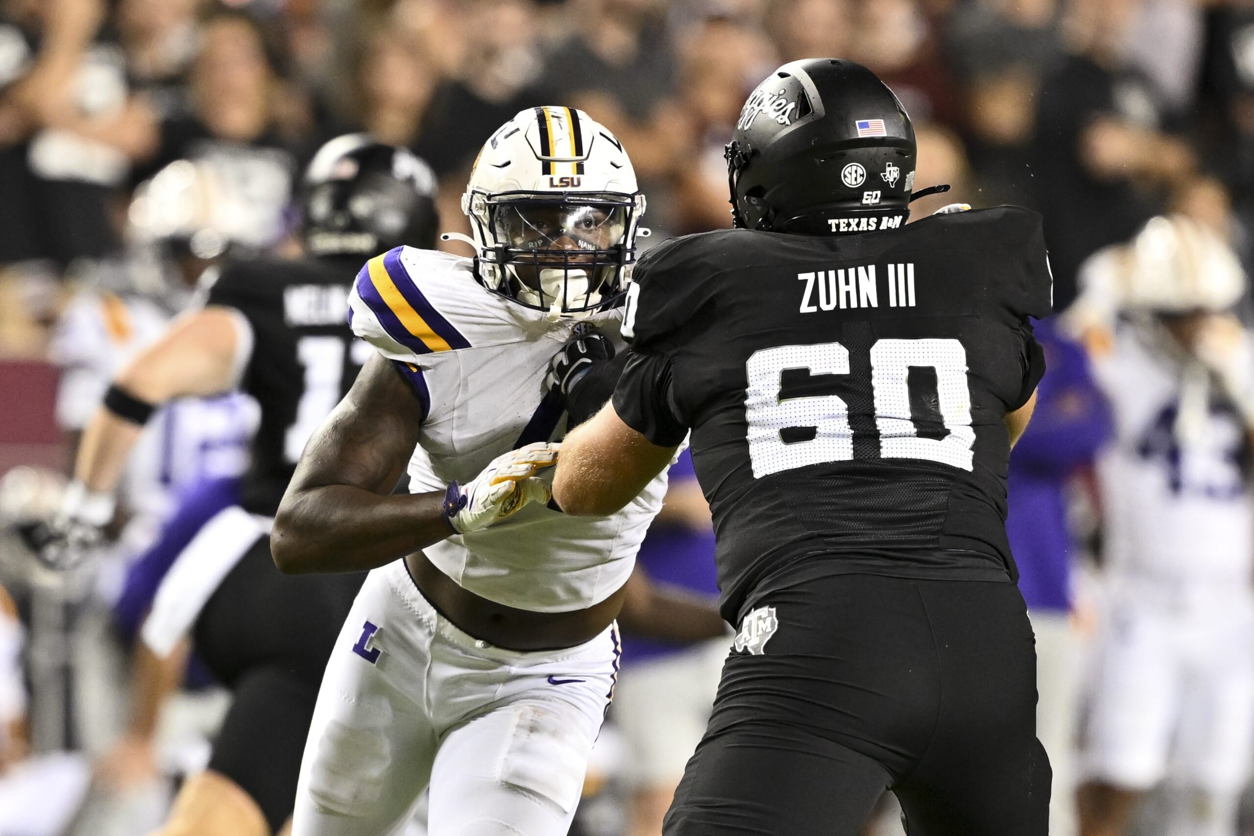 LSU Tigers defensive end Bradyn Swinson (4) defends against the Texas A&M Aggies during the third quarter.