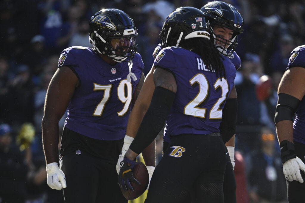 Baltimore Ravens running back Derrick Henry (22) celebrates with offensive tackle Ronnie Stanley (79)  after scoring a touchdown against the Denver Broncos at M&T Bank Stadium. 