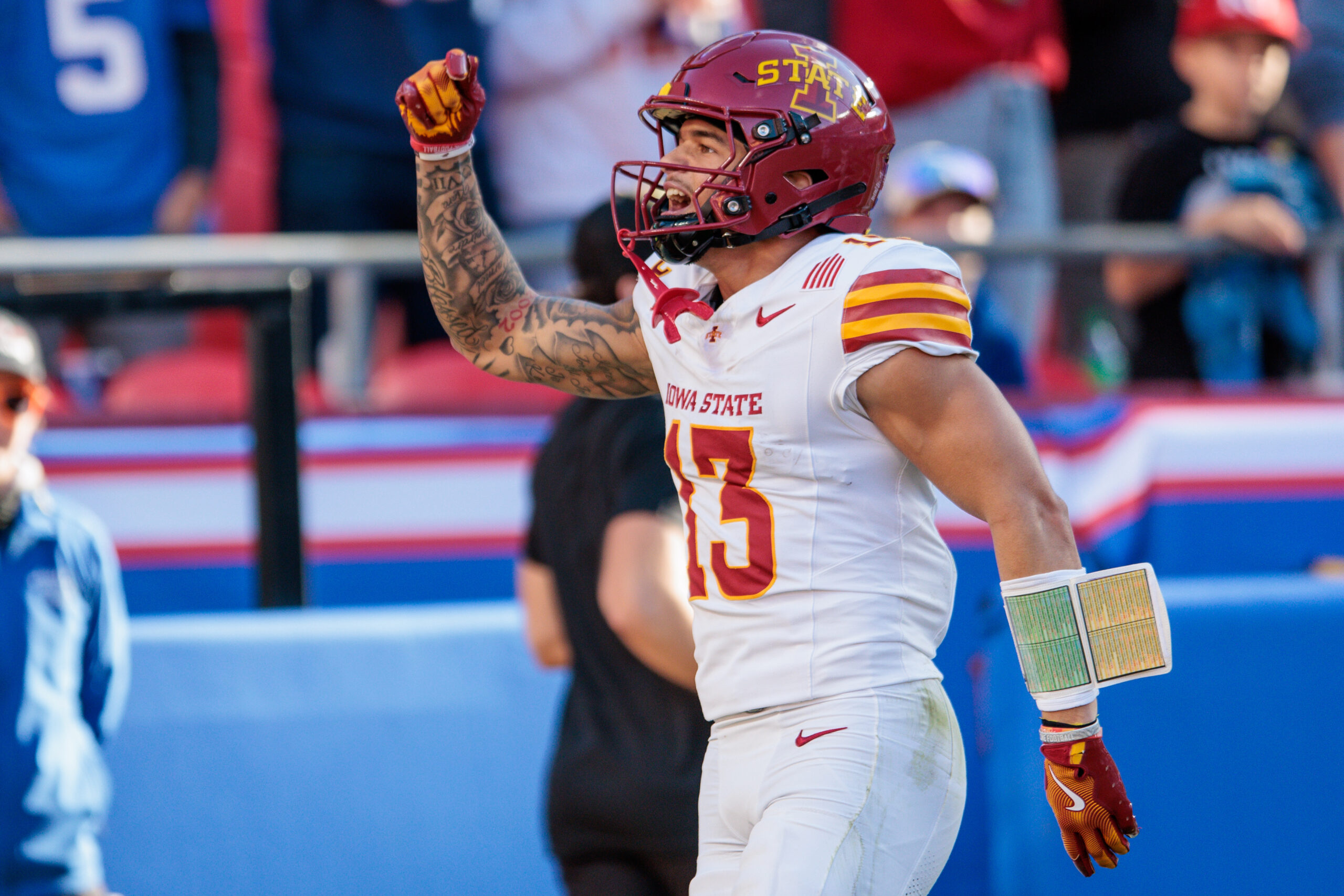 Iowa State Cyclones wide receiver Jaylin Noel (13) celebrates after scoring a touchdown during the first quarter against the Kansas Jayhawks at GEHA Field.