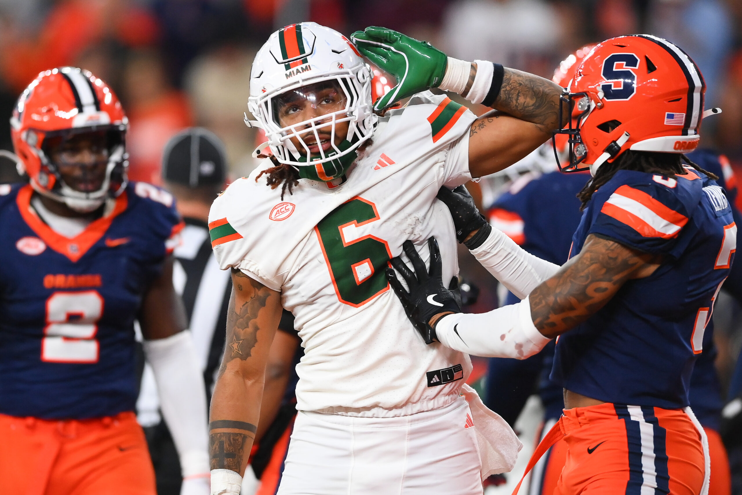 Miami Hurricanes running back Damien Martinez (6) gestures to fans after running for a touchdown against the Syracuse Orange during the second half at the JMA Wireless Dome.