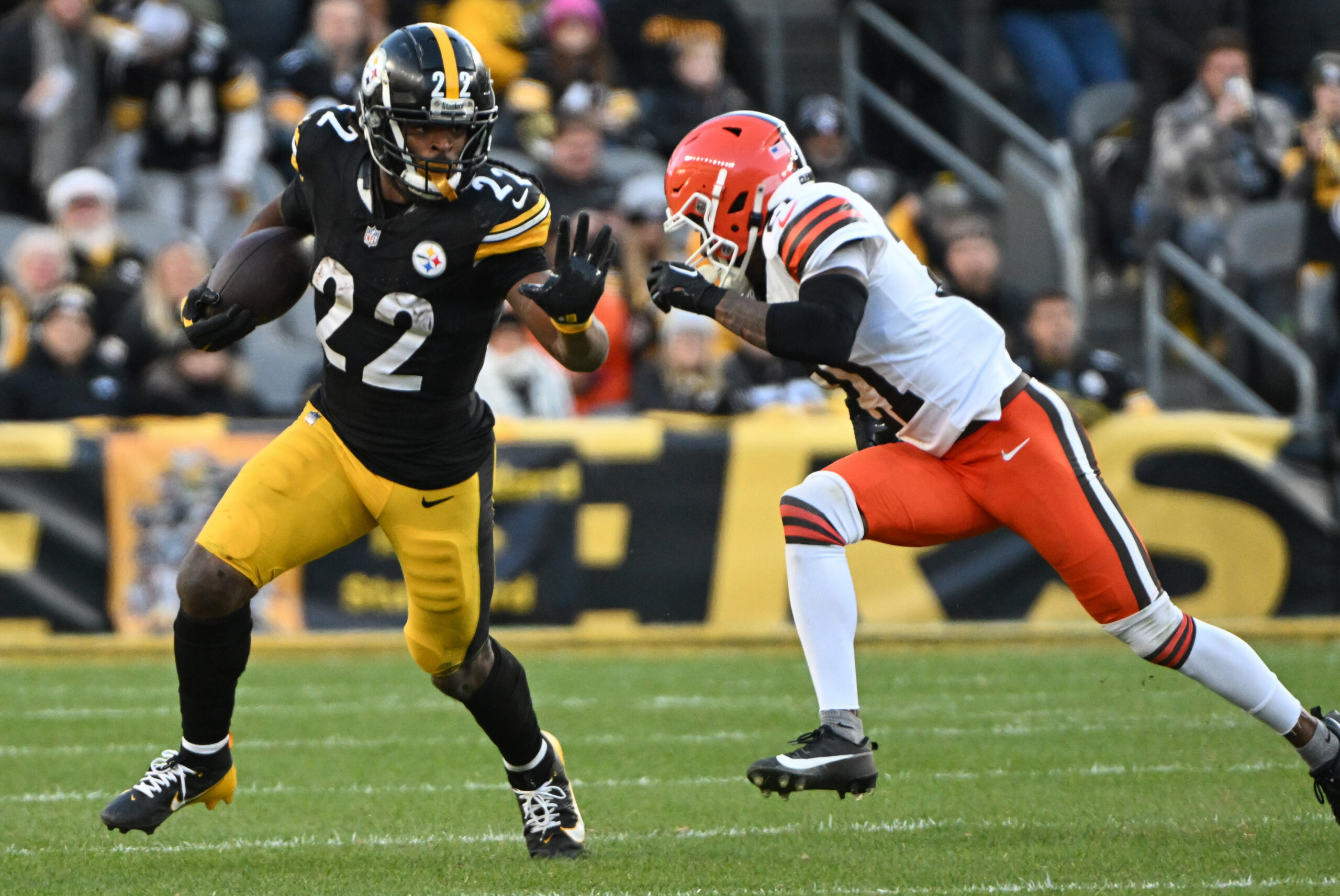 Pittsburgh Steelers running back Najee Harris (22) looks to stiff arm Cleveland Browns cornerback Denzel Ward (21) during the fourth quarter at Acrisure Stadium.