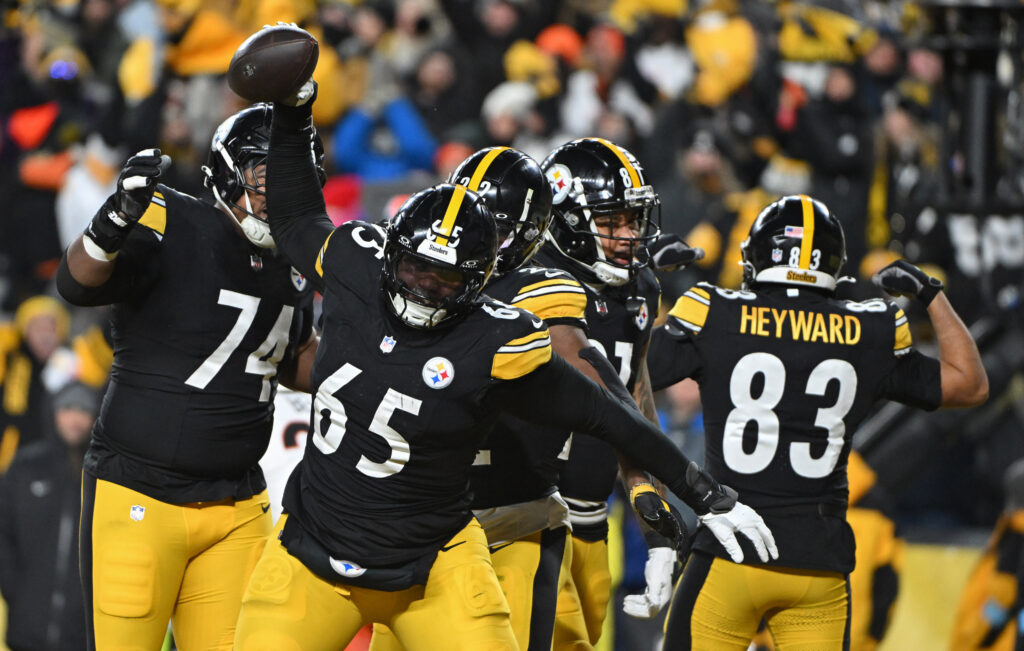 Pittsburgh Steelers offensive tackle Dan Moore Jr. (65) celebrates after a touchdown by running back Najee Harris (22) against the Cincinnati Bengals. 