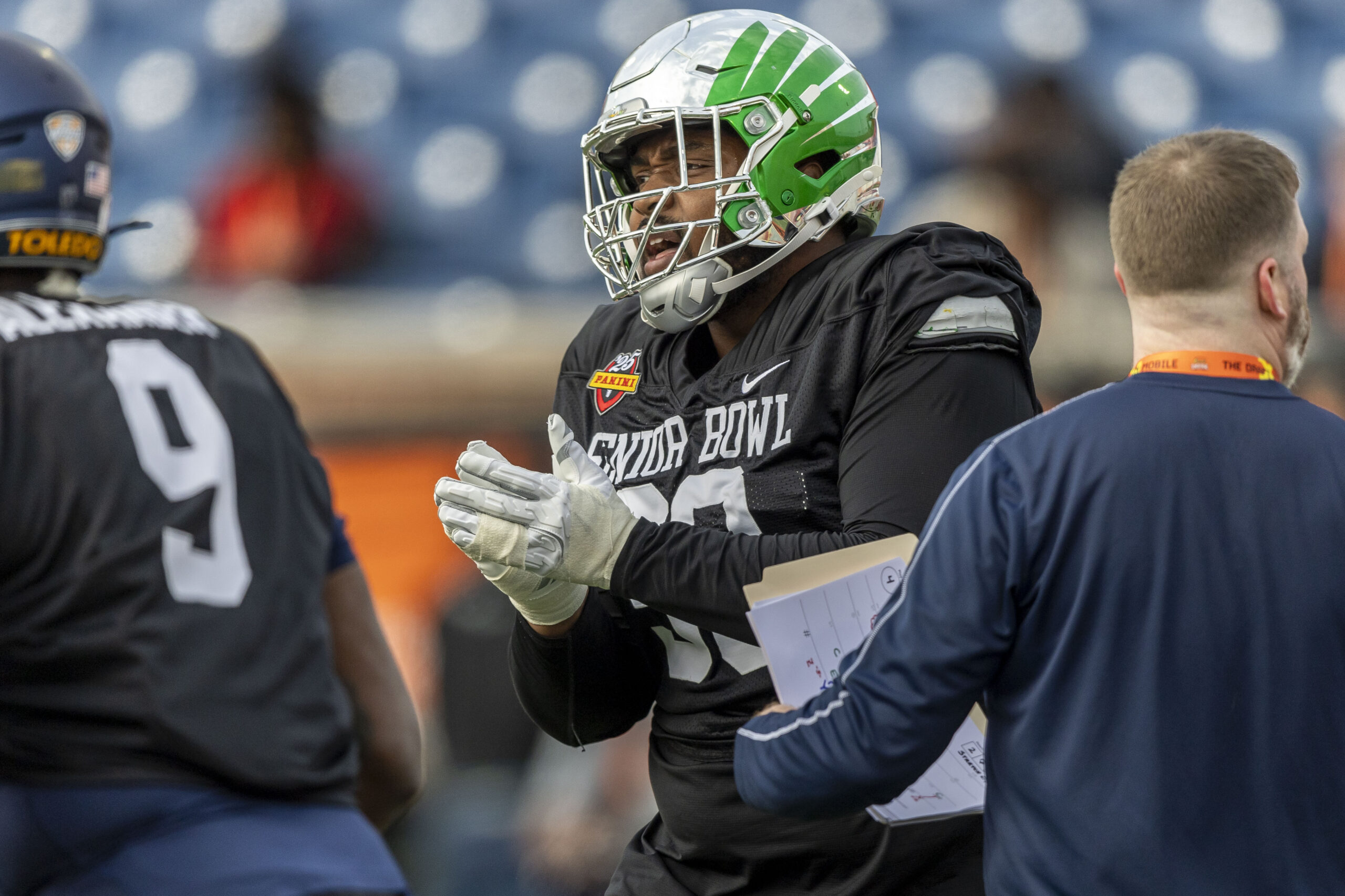 National team defensive lineman Jamaree Caldwell of Oregon (90) celebrates after a play during Senior Bowl practice for the National team at Hancock Whitney Stadium.