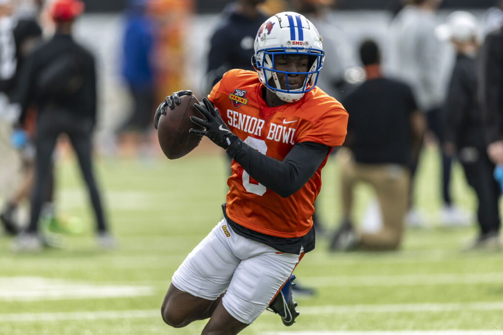 American team running back Brashard Smith of SMU (0) runs after a catch during Senior Bowl practice for the American team at Hancock Whitney Stadium.