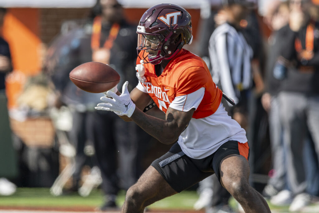 National team wide receiver Da'Quan Felton of Virginia Tech (5) grabs a pass during Senior Bowl practice for the National team at Hancock Whitney Stadium.