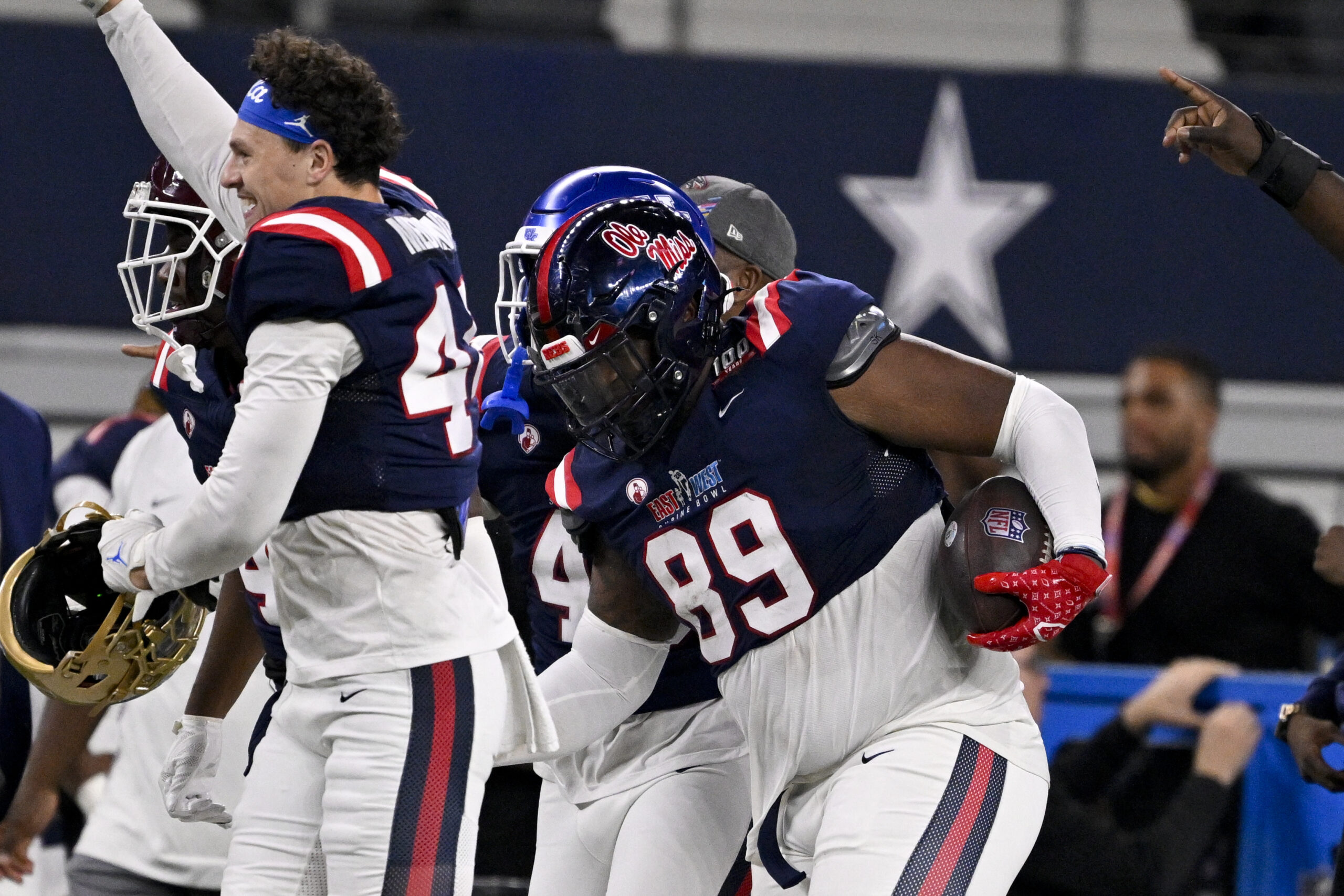 The East team celebrates after East defensive lineman JJ Pegues of Ole Miss (89) intercepts a pass during the second half against the West at AT&T Stadium.