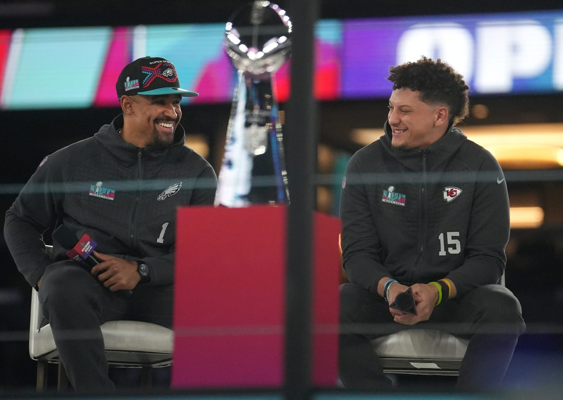 Kansas City Chiefs quarterback Patrick Mahomes, right, and Philadelphia Eagles quarterback Jalen Hurts, left, share the stage in downtown Phoenix during Super Bowl 57.